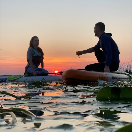 Закат на сапбордах на Лахтинском Разливе в Петербурге